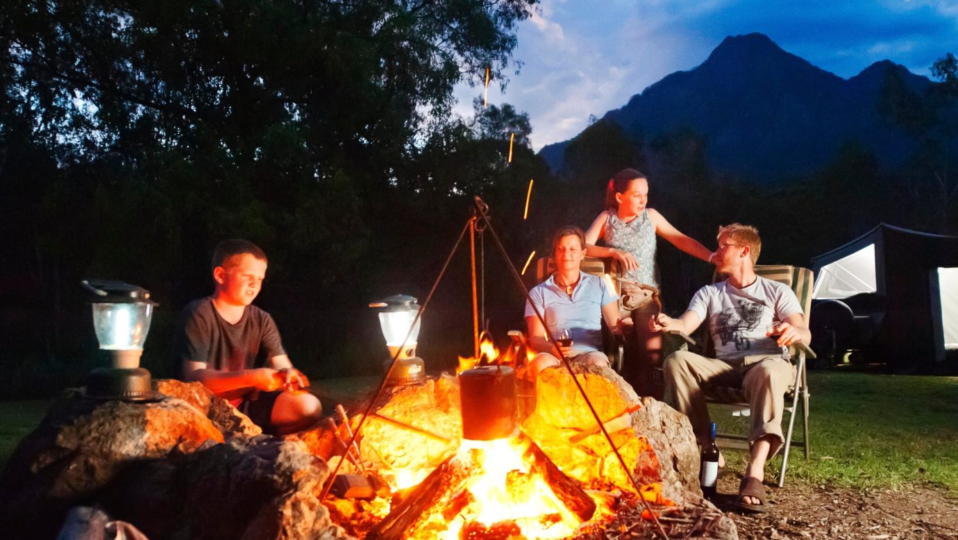 A Family sitting around the Fire.