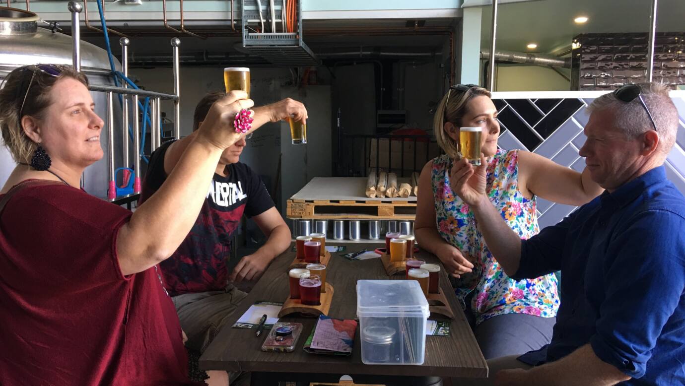 Inspecting the colour of their beer