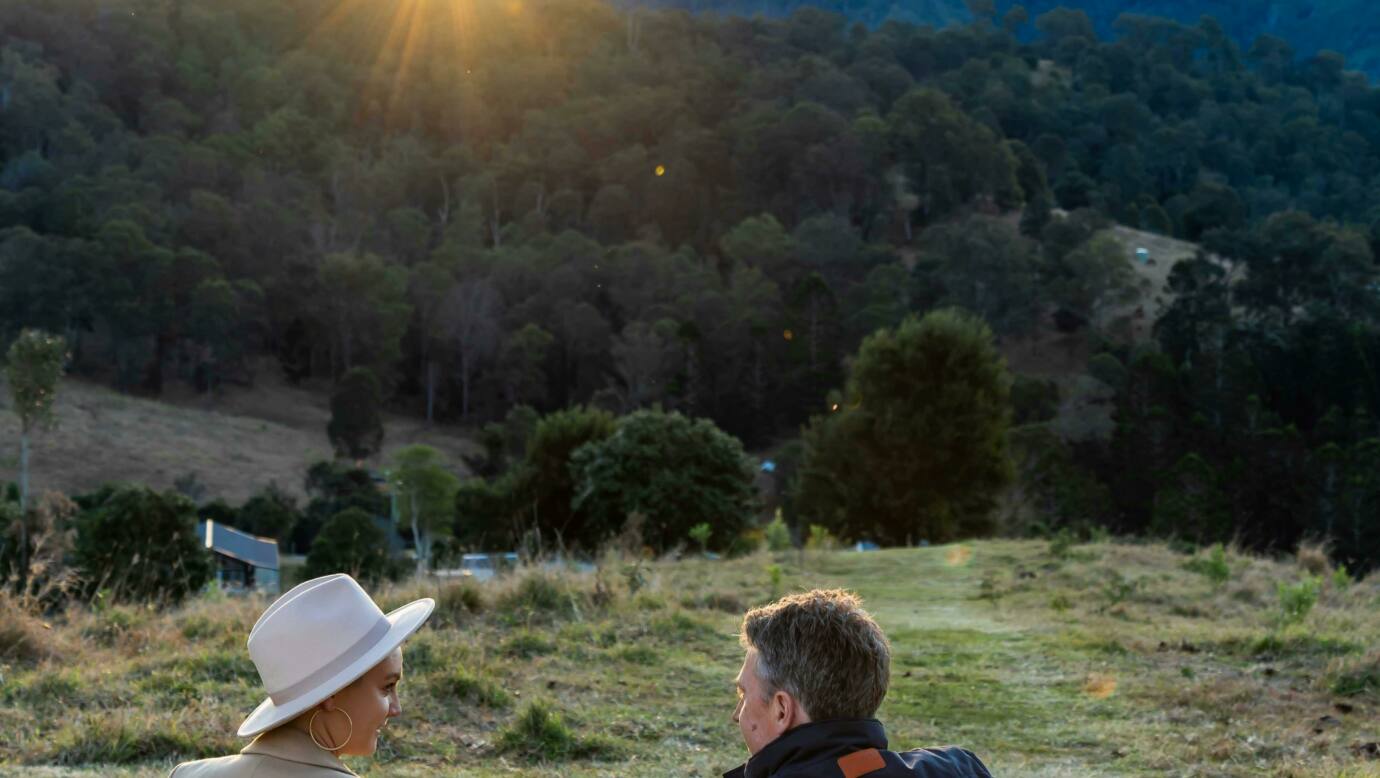 Couple having a picnic, taking the view of Country Mile Escape