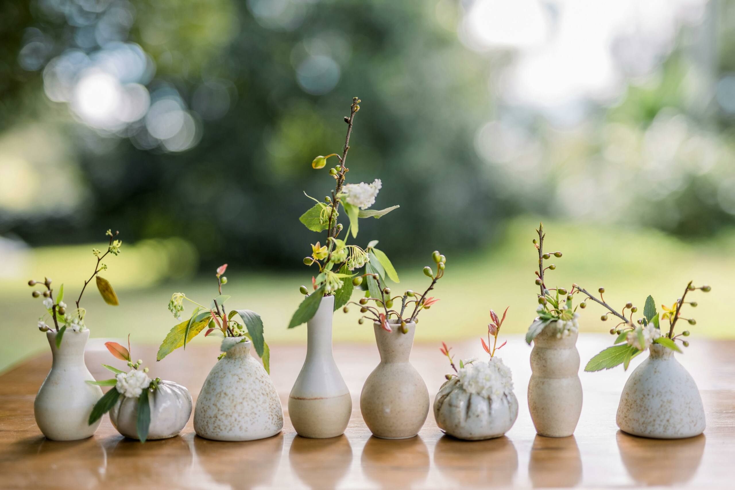 row of ceramic bud vases by Wedding Ceramics by PJ Pottery