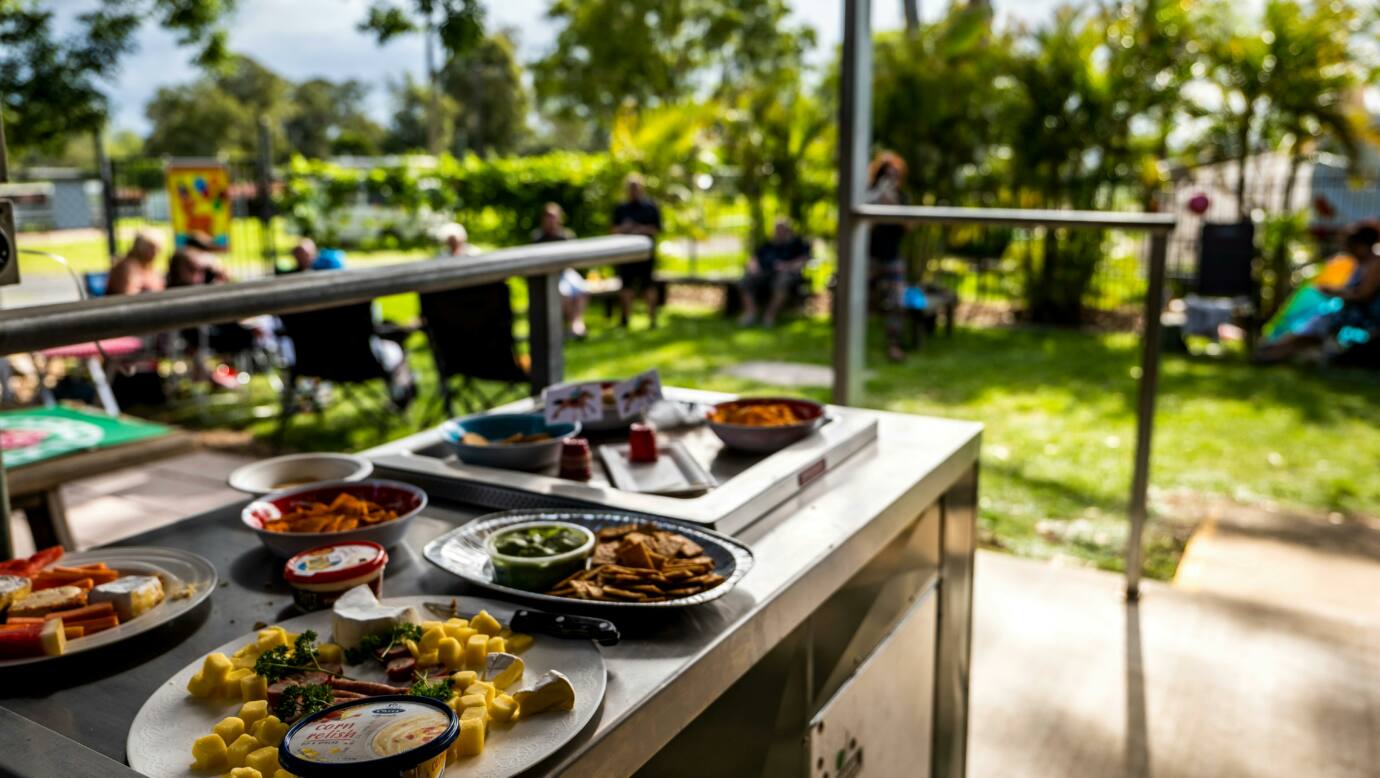 Our camp kitchen dining areas hosting an event, with food platters and our park guests chatting.