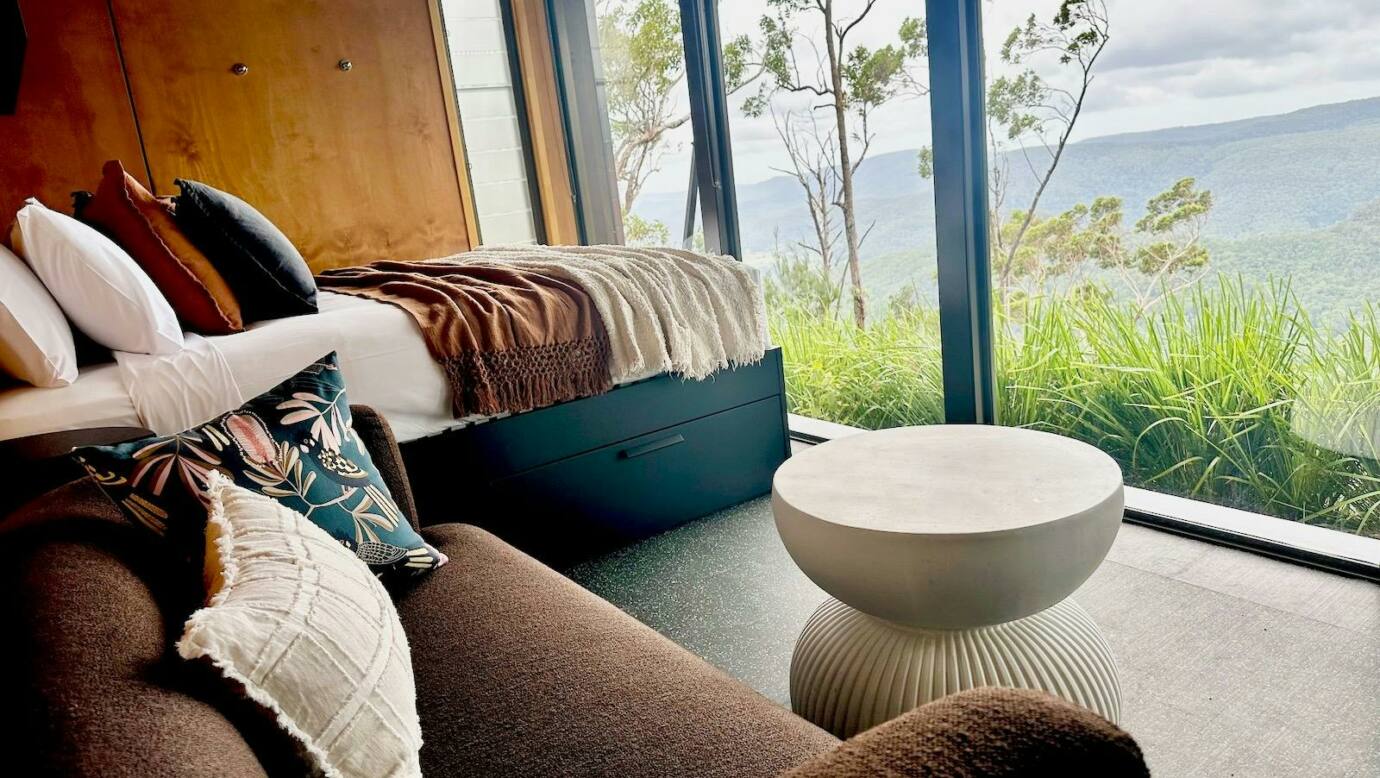 Tiny Wild House bedroom and lounge with views of the Ship Sterns Range from Binna Burra