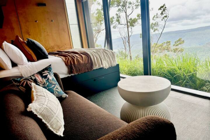 Tiny Wild House bedroom and lounge with views of the Ship Sterns Range from Binna Burra