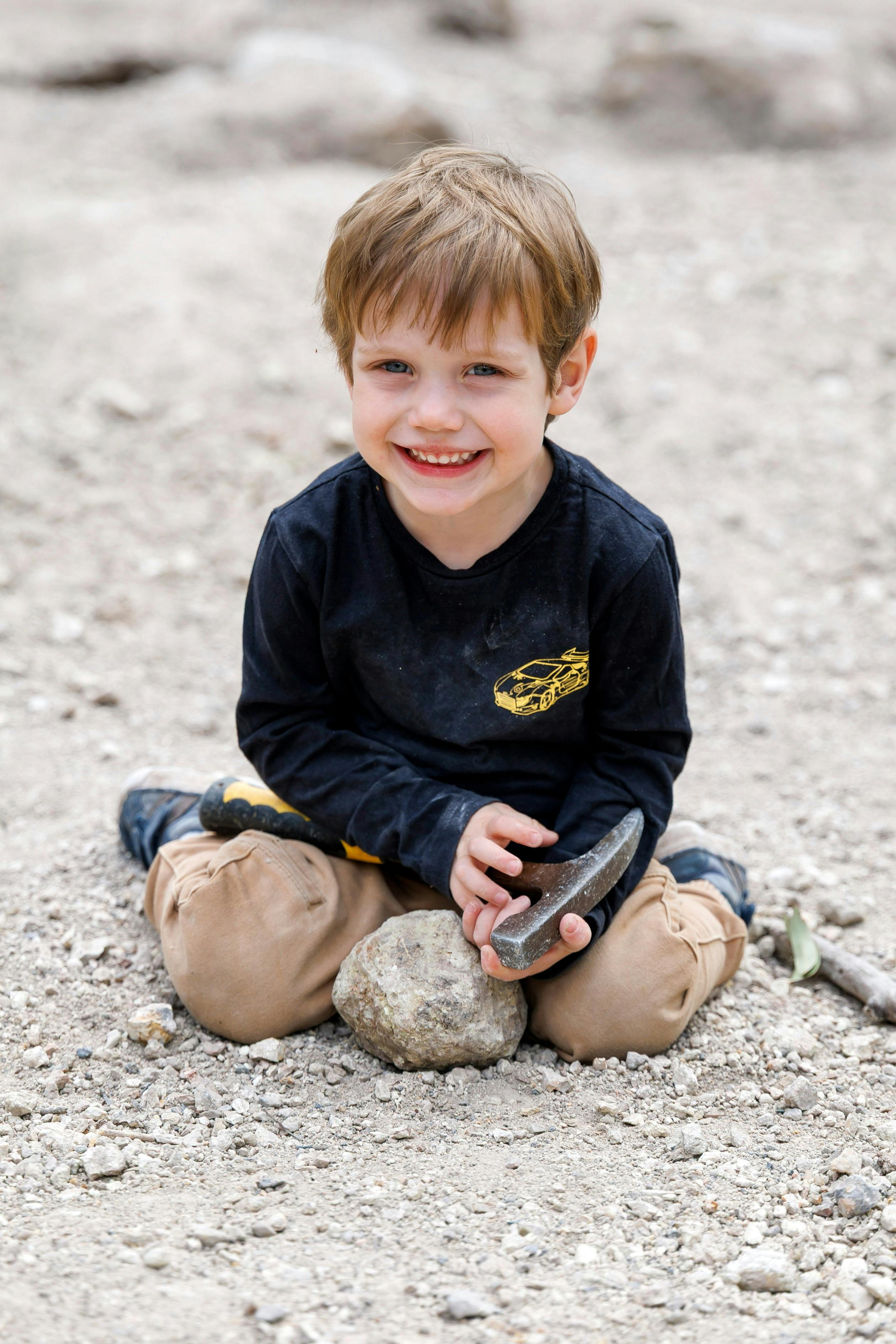 A junior fossicker with his thunderegg.